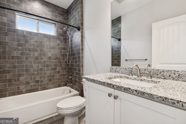 full bathroom with vanity, toilet, and tiled shower / bath combo