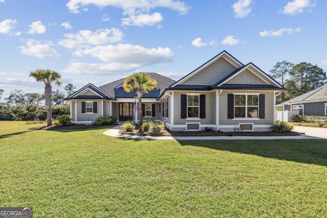 ranch-style home with a front lawn