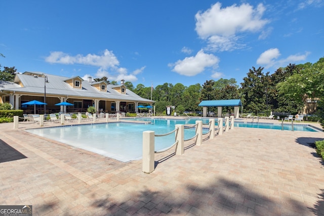 view of swimming pool with a patio