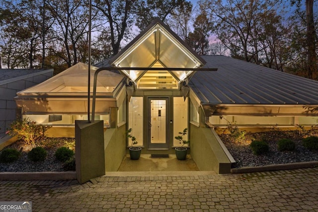 view of front facade with glass enclosure