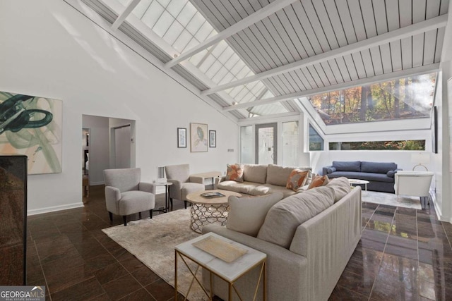 living room featuring beam ceiling and high vaulted ceiling