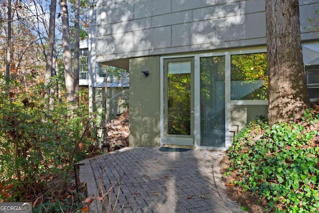 doorway to property featuring a patio