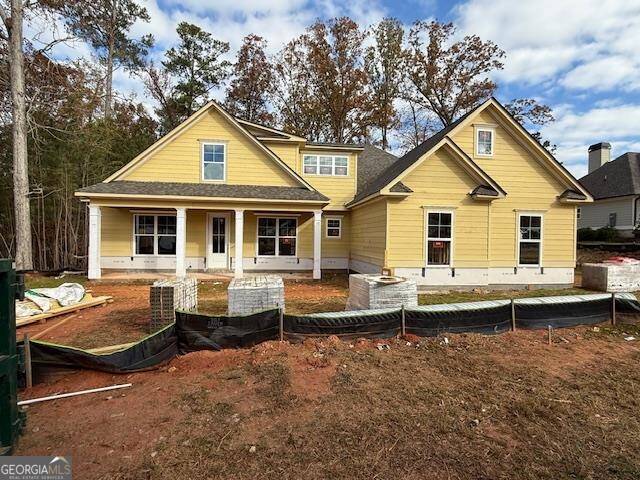 back of house with a porch