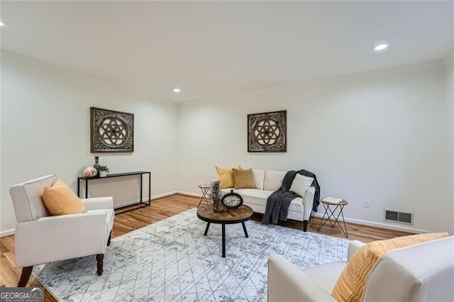 living room with light hardwood / wood-style floors