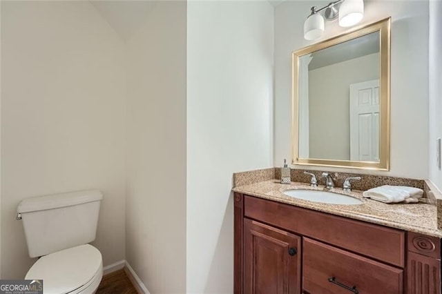 bathroom with vanity and toilet