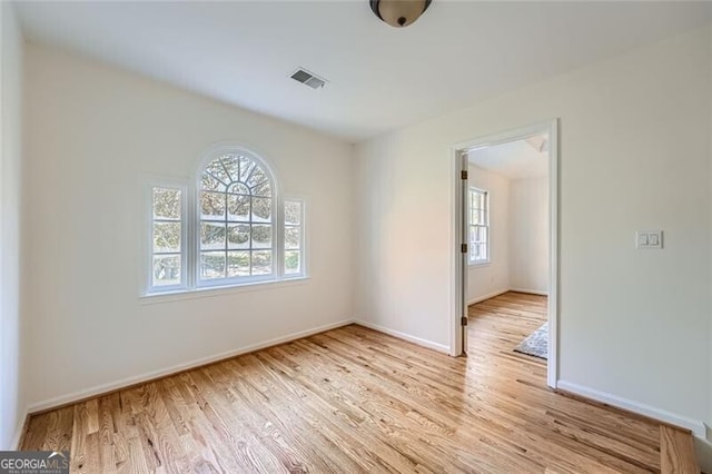 unfurnished room featuring light hardwood / wood-style flooring