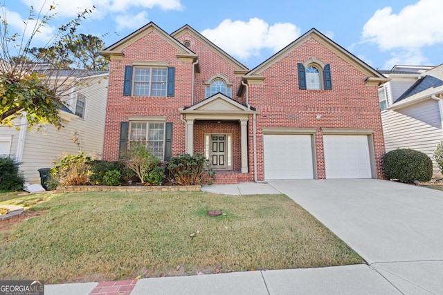 view of front of home featuring a garage and a front lawn