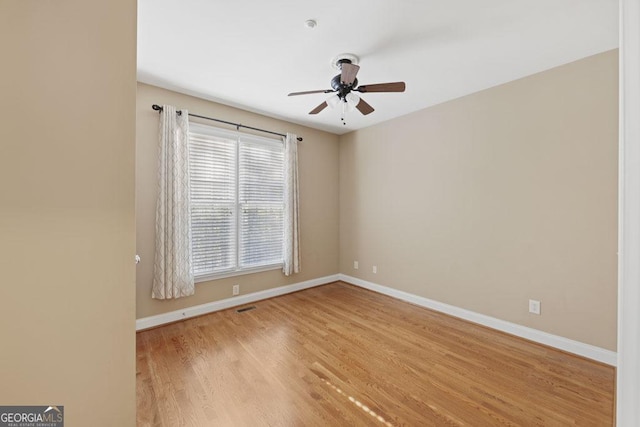 727 Pear Grove Pl, Marietta, GA 30066 - spare room with a ceiling fan, baseboards, and wood finished floors