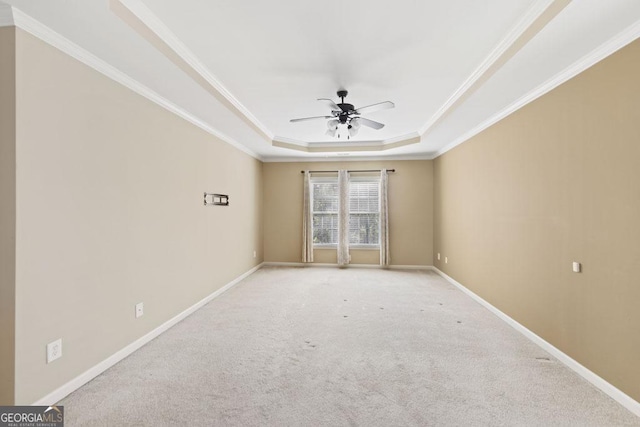 727 Pear Grove Pl, Marietta, GA 30066 - carpeted spare room with a tray ceiling, a ceiling fan, crown molding, and baseboards