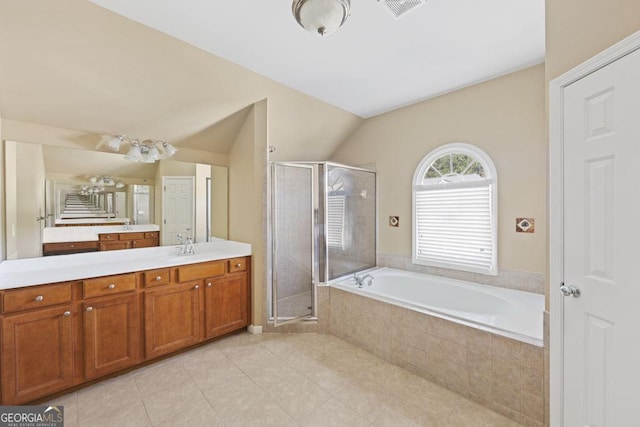 727 Pear Grove Pl, Marietta, GA 30066 - bathroom with vanity, a stall shower, a bath, tile patterned flooring, and vaulted ceiling