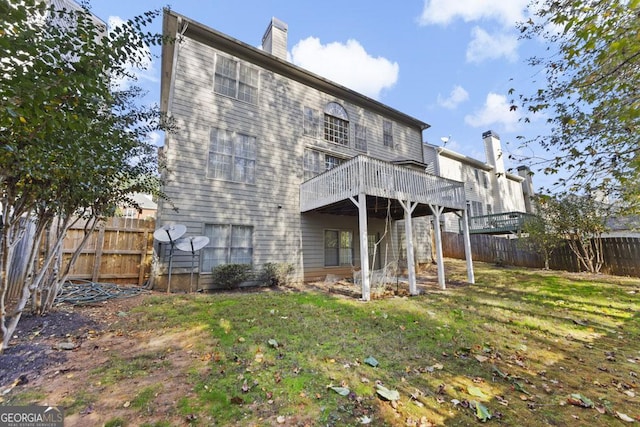 727 Pear Grove Pl, Marietta, GA 30066 - back of property with a deck and a chimney