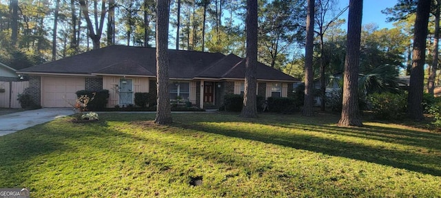 ranch-style home with a front lawn and a garage