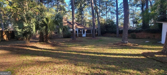 view of yard with a sunroom