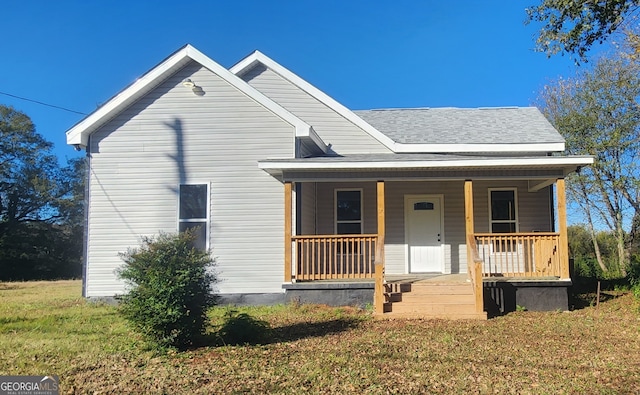 view of front of property featuring a porch and a front yard