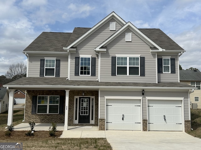 view of front of property featuring covered porch, concrete driveway, and brick siding