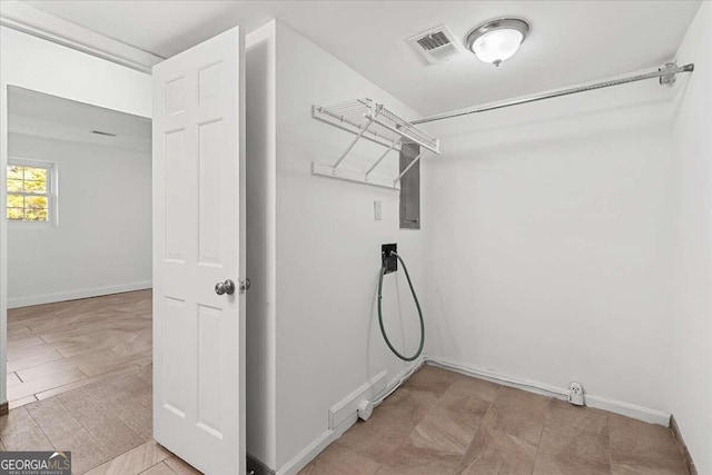 6166 Laurel Wood Trl, Flowery Branch, GA 30542 - laundry area with baseboards and light tile patterned floors