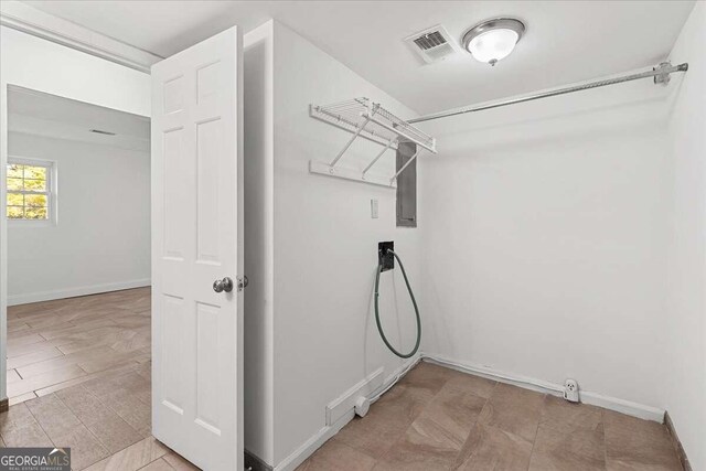 6166 Laurel Wood Trl, Flowery Branch, GA 30542 - laundry room featuring baseboards and light tile patterned floors