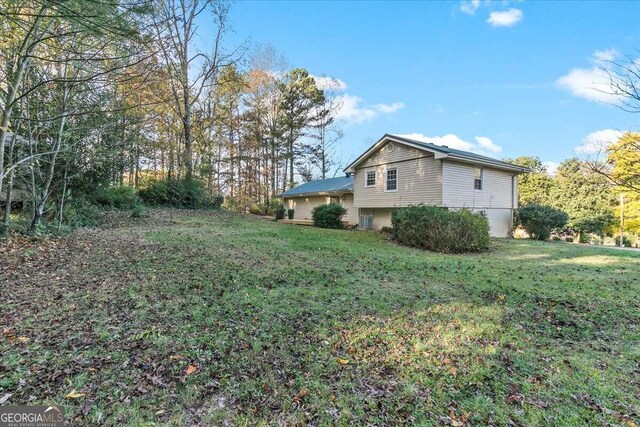 6166 Laurel Wood Trl, Flowery Branch, GA 30542 - view of grassy yard