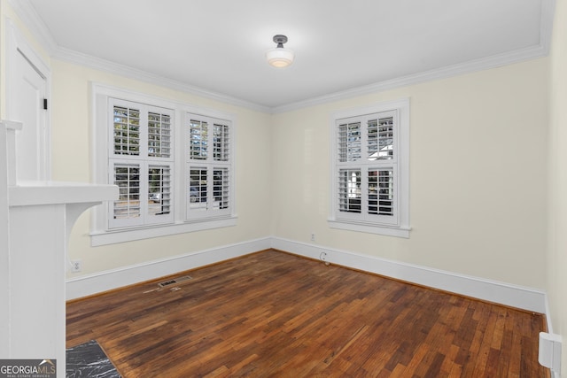 unfurnished room with dark hardwood / wood-style floors and ornamental molding