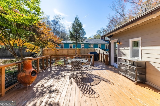 wooden terrace featuring grilling area