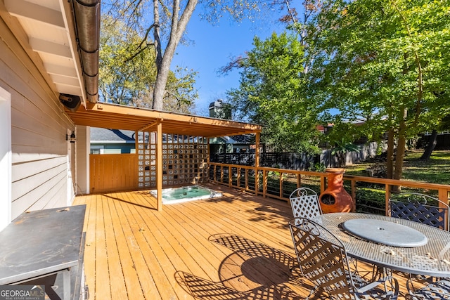 wooden terrace with a jacuzzi