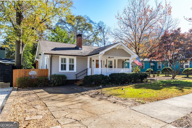 ranch-style house featuring a front yard and a porch