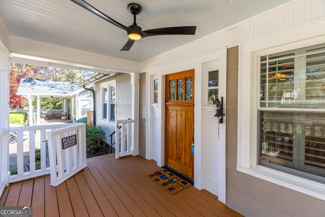 deck featuring a porch and ceiling fan