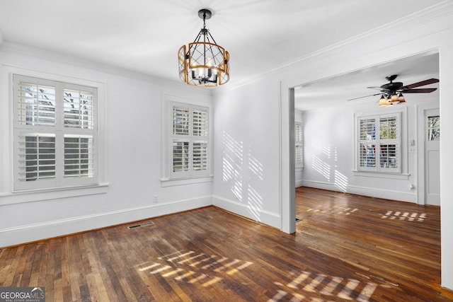 unfurnished dining area with crown molding, dark wood-type flooring, and ceiling fan with notable chandelier