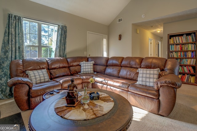 living room with carpet floors and vaulted ceiling