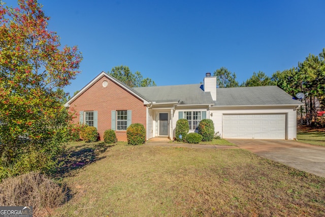 view of front of house with a garage and a front yard