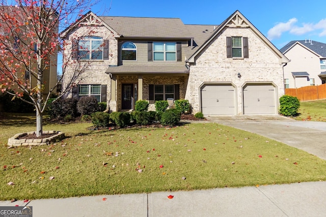 craftsman-style home with a garage and a front yard