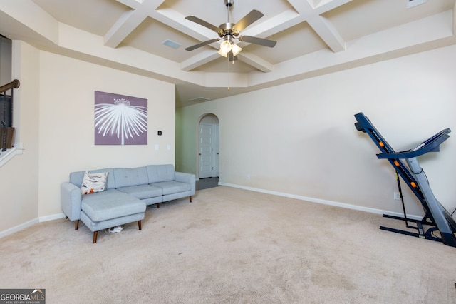 sitting room featuring beamed ceiling, light carpet, and coffered ceiling