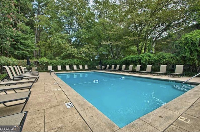 view of pool featuring a patio