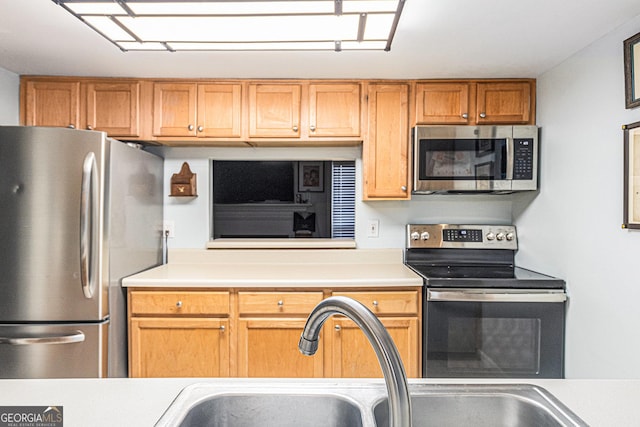 kitchen with light tile patterned floors and appliances with stainless steel finishes