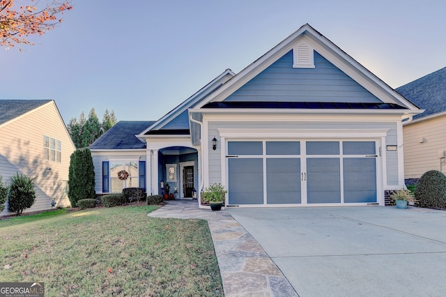 view of front facade featuring a front lawn and a garage