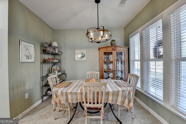 dining room with a notable chandelier