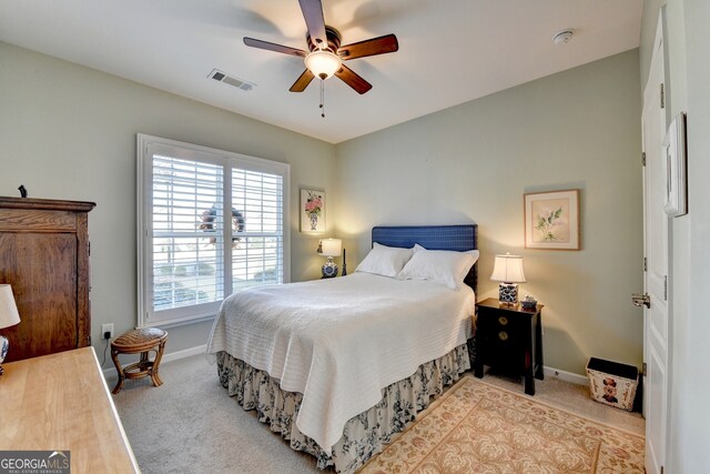 carpeted bedroom with ceiling fan