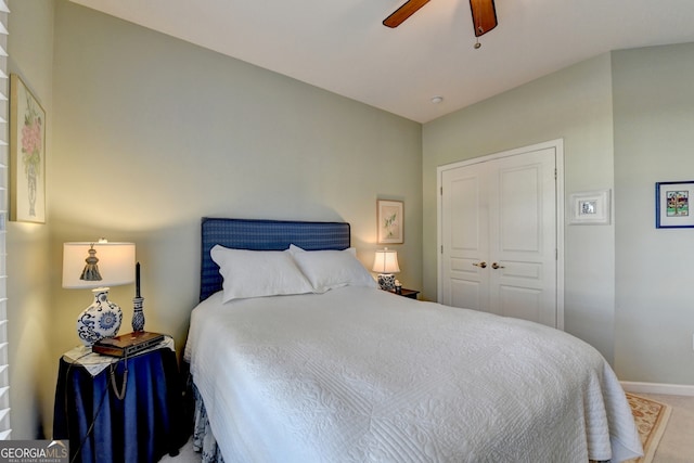 carpeted bedroom with a closet and ceiling fan