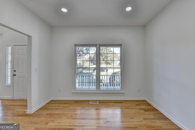 spare room with light wood-type flooring