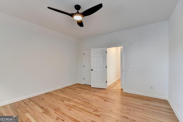 empty room featuring ceiling fan and light hardwood / wood-style floors