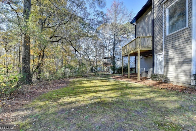 view of yard featuring a wooden deck