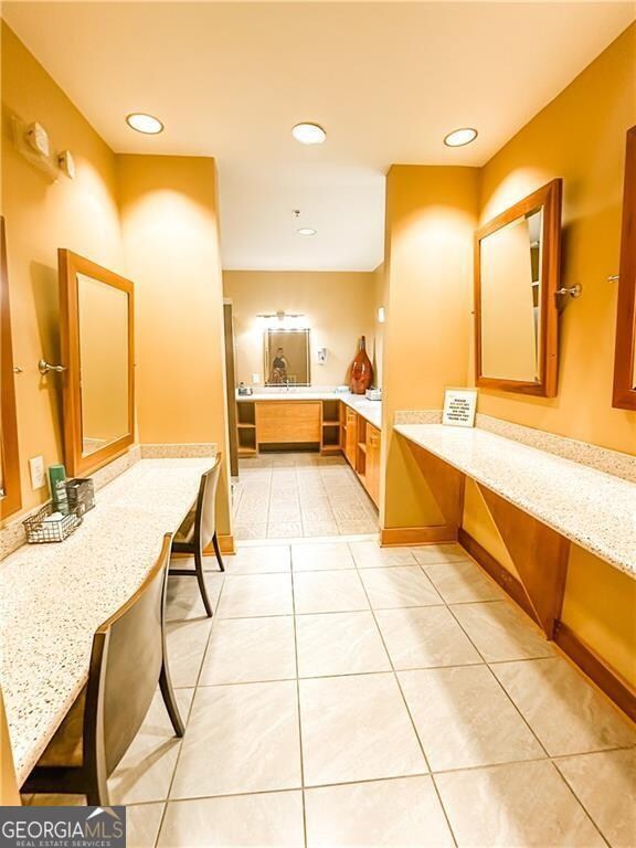 bathroom with tile patterned flooring and vanity