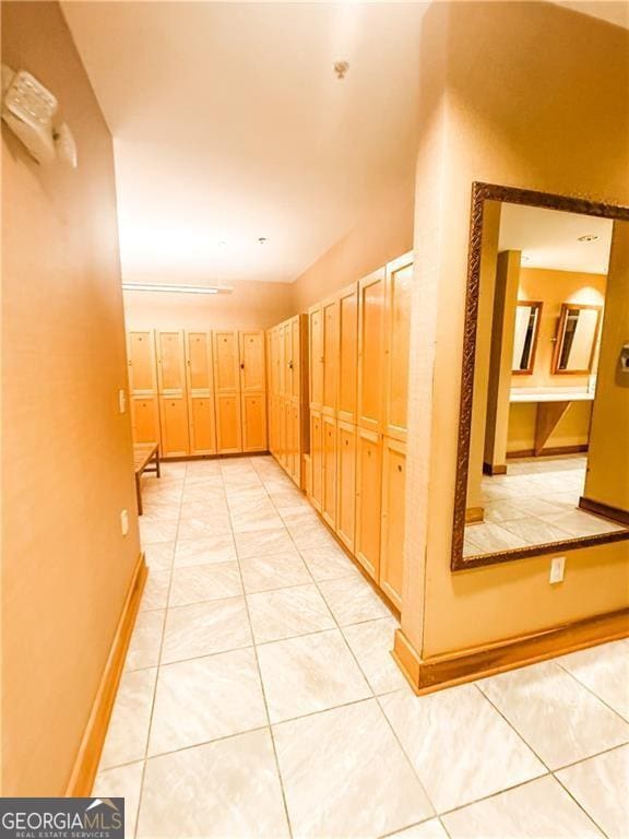 hallway featuring light tile patterned flooring