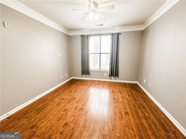 unfurnished room featuring hardwood / wood-style floors, ceiling fan, and ornamental molding