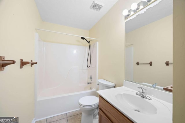 full bathroom with tile patterned floors, shower / tub combination, vanity, and toilet