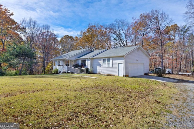 view of front of home featuring a garage and a front lawn