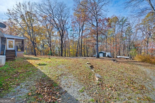 view of yard featuring a sunroom