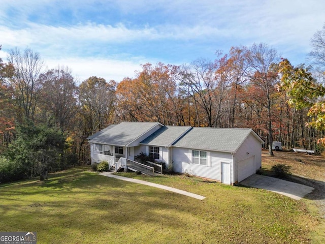 single story home with a garage and a front lawn