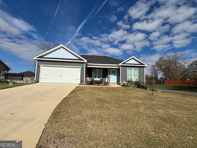 ranch-style house featuring a front yard and a garage