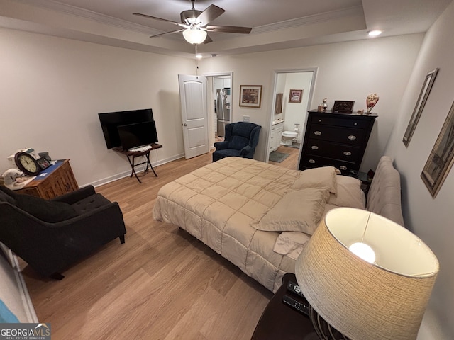 bedroom with hardwood / wood-style flooring, stainless steel fridge, and crown molding